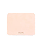 Rectangular beige leather Launcher Mouse Pad with a suede underside, rounded edges, and the brand "Bed Stu" embossed at the bottom center, perfect for a curated workspace.