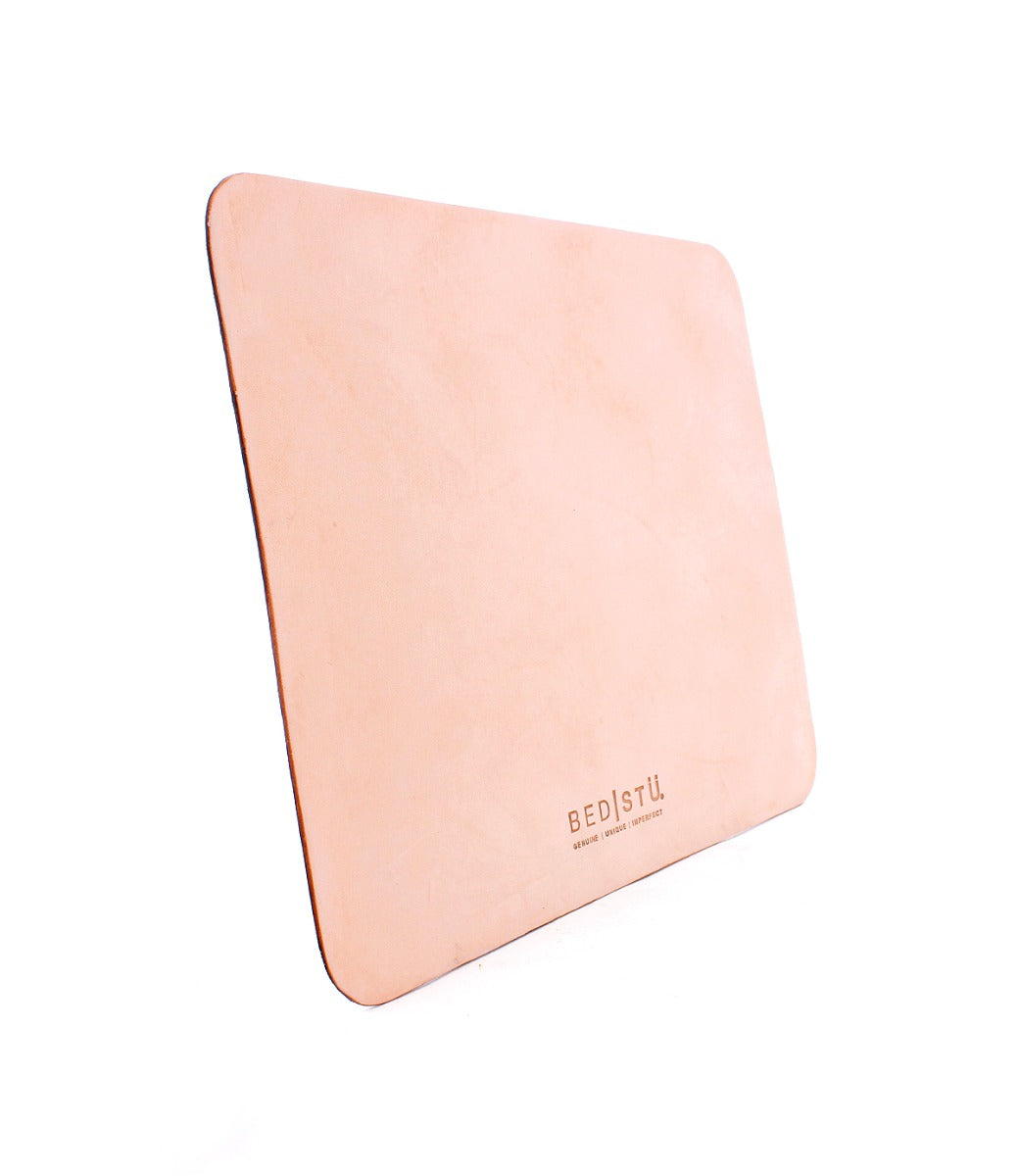 A Launcher by Bed Stu pink leather mouse pad on a white background.