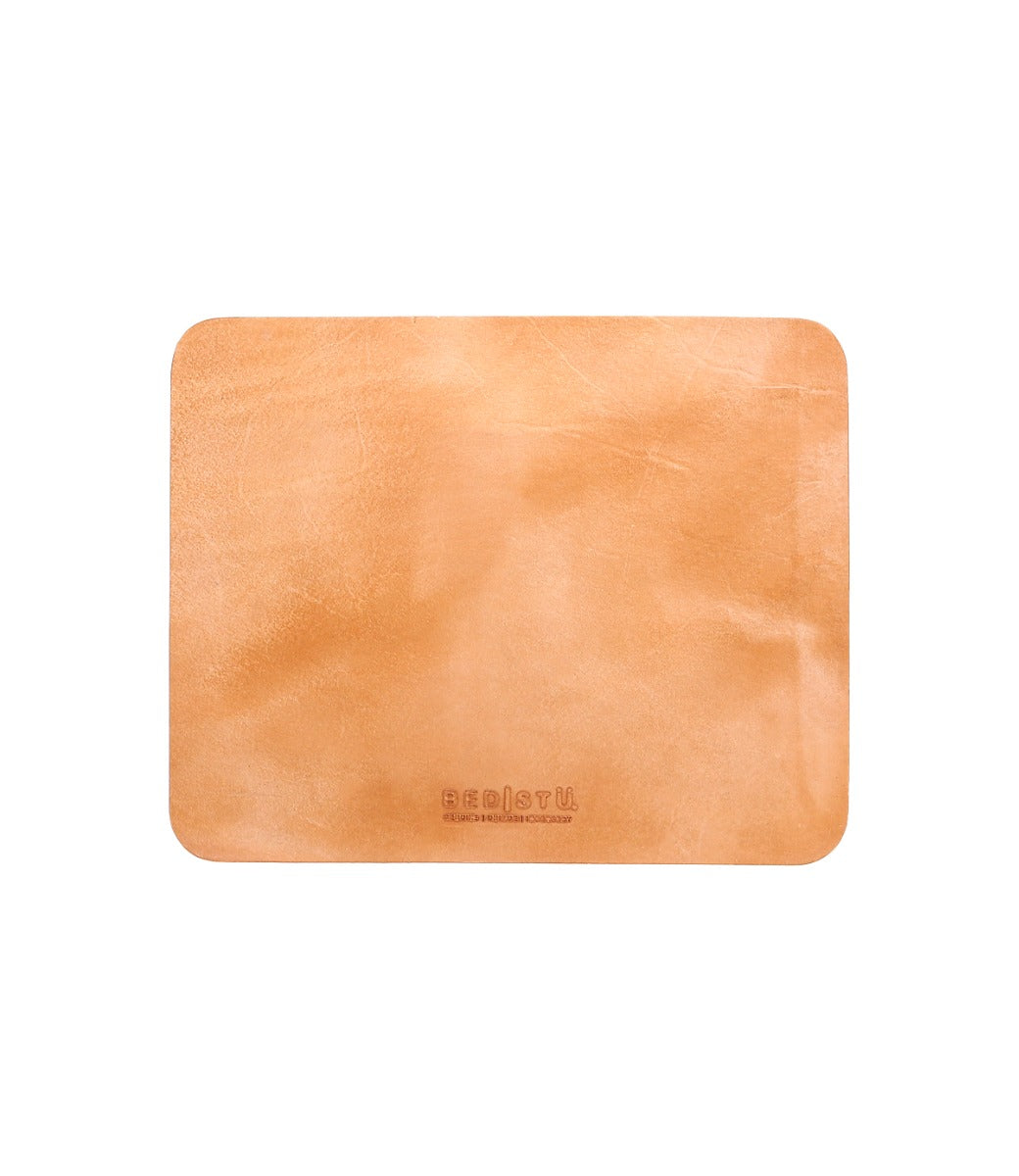 A Bed Stu Launcher tan leather coaster on a white background.
