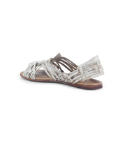 Side and rear view of the worn white Lauren II sandal by Bed Stu, showcasing its hand-woven leather straps, square-toe design, and flat sole.