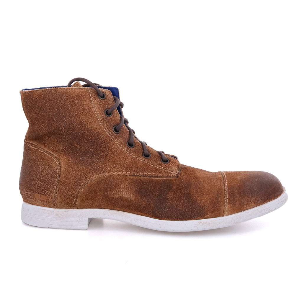 A pair of men's brown Leonardo boots with laces and a white sole by Bed Stu.