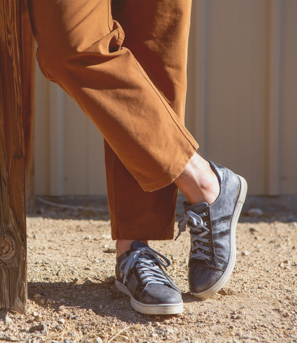 A man wearing a pair of Bed Stu Lighthouse sneakers.