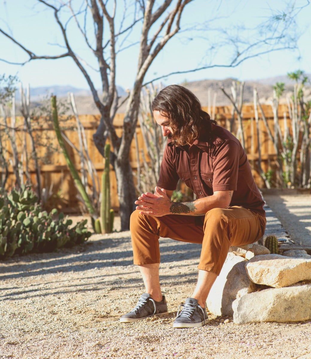 A man wearing a pair of Bed Stu Lighthouse sneakers.