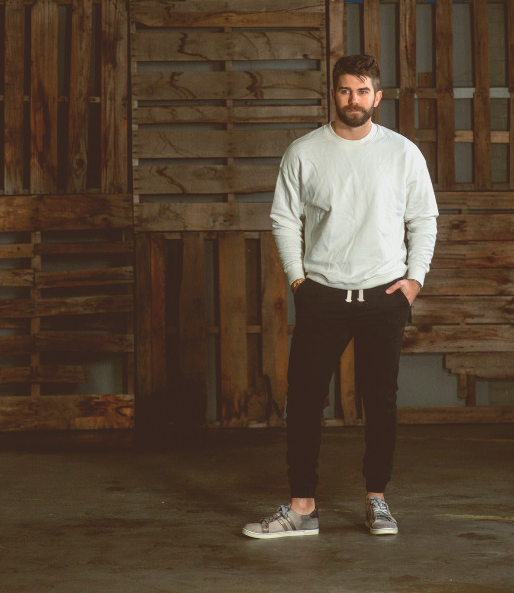 A man wearing a pair of Bed Stu Lighthouse sneakers.