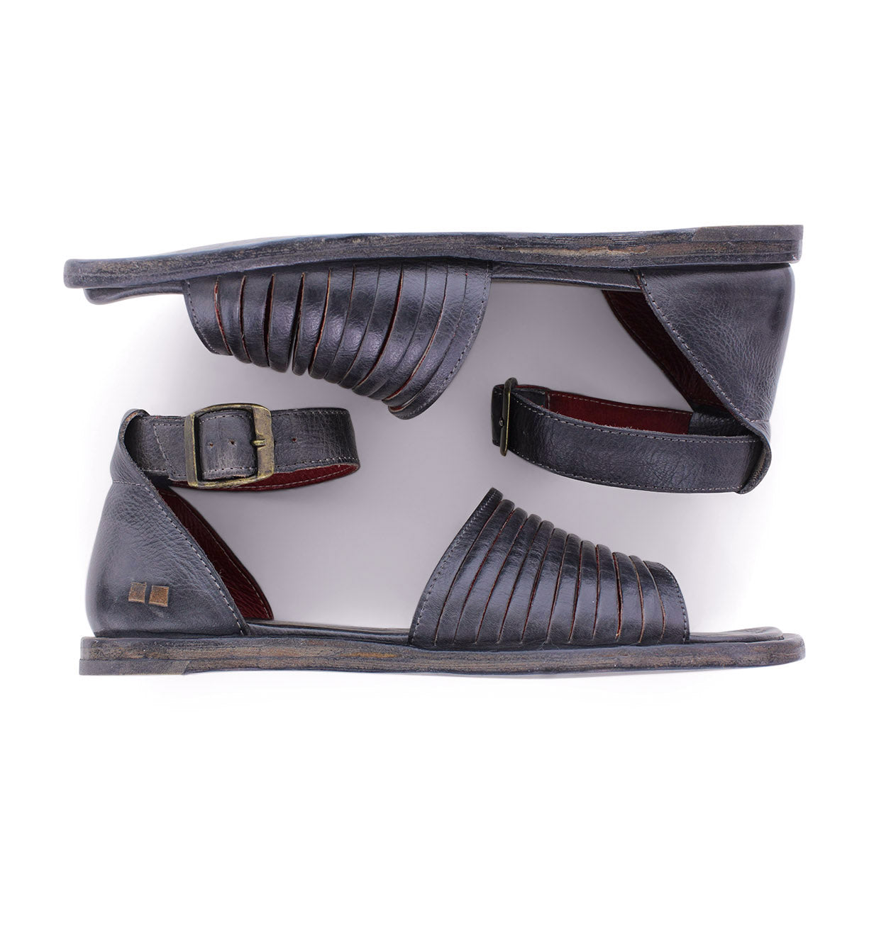A pair of Lilia sandals by Bed Stu, made of grey leather, on a white background.
