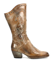 The Limit by Bed Stu, a brown leather cowboy boot adorned with decorative floral stitching and metal studs, featuring a slightly slanted heel and a pointed toe, embodies the classic charm of Western mid-calf boots.