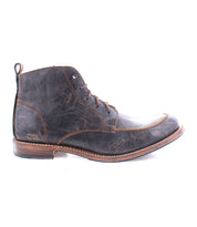A side view of the rugged Lincoln II boot from Bed Stu reveals a dark brown leather ankle design with a textured finish, wooden sole, and classic lace-up style.