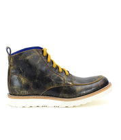 Introducing the Lincoln by Bed Stu: a classic men's leather boot in dark brown that features yellow laces, a white sole with a slight tread for grip, and a blue pull tab at the back—perfect for casual male attire.