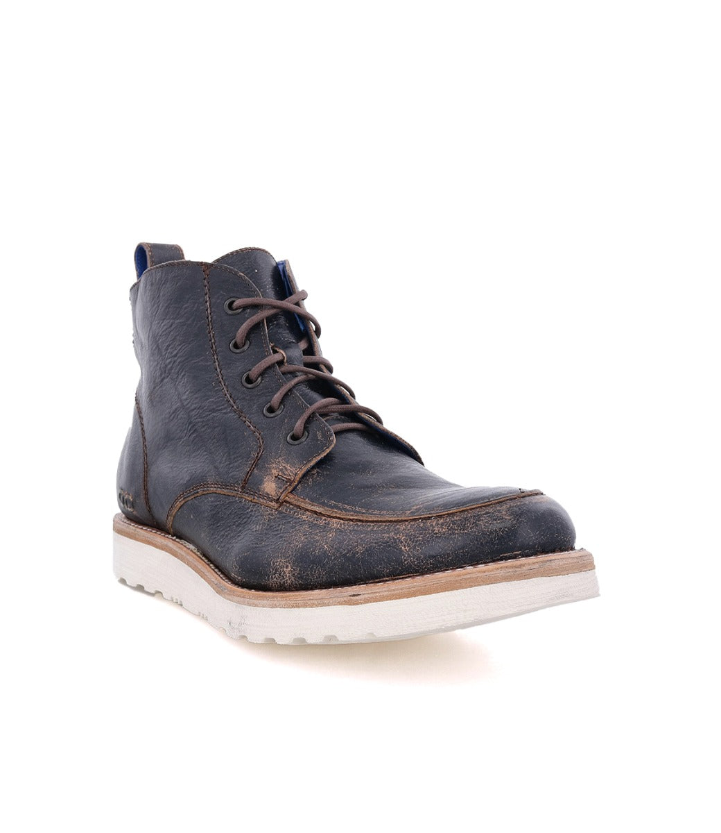 A men's Lincoln leather boot with laces and a white sole by Bed Stu.