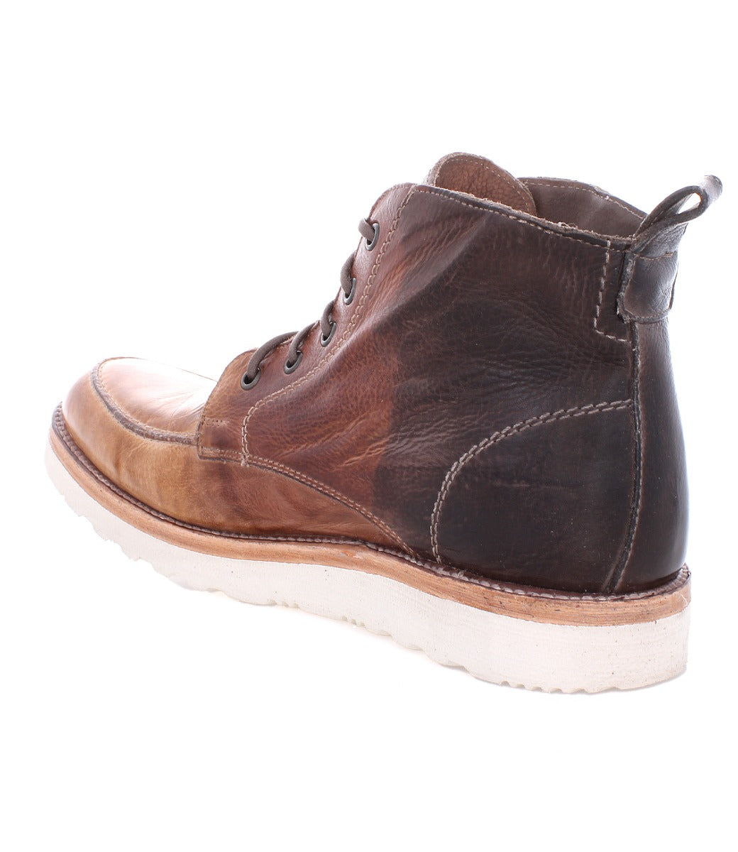 A single brown men's leather boot with laces, viewed from the side, isolated on a white background.The Lincoln Boot by Bed Stu.