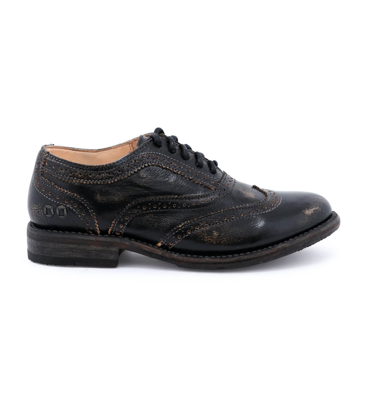 A women's distressed black wingtip oxford shoe called "Lita" by Bed Stu.