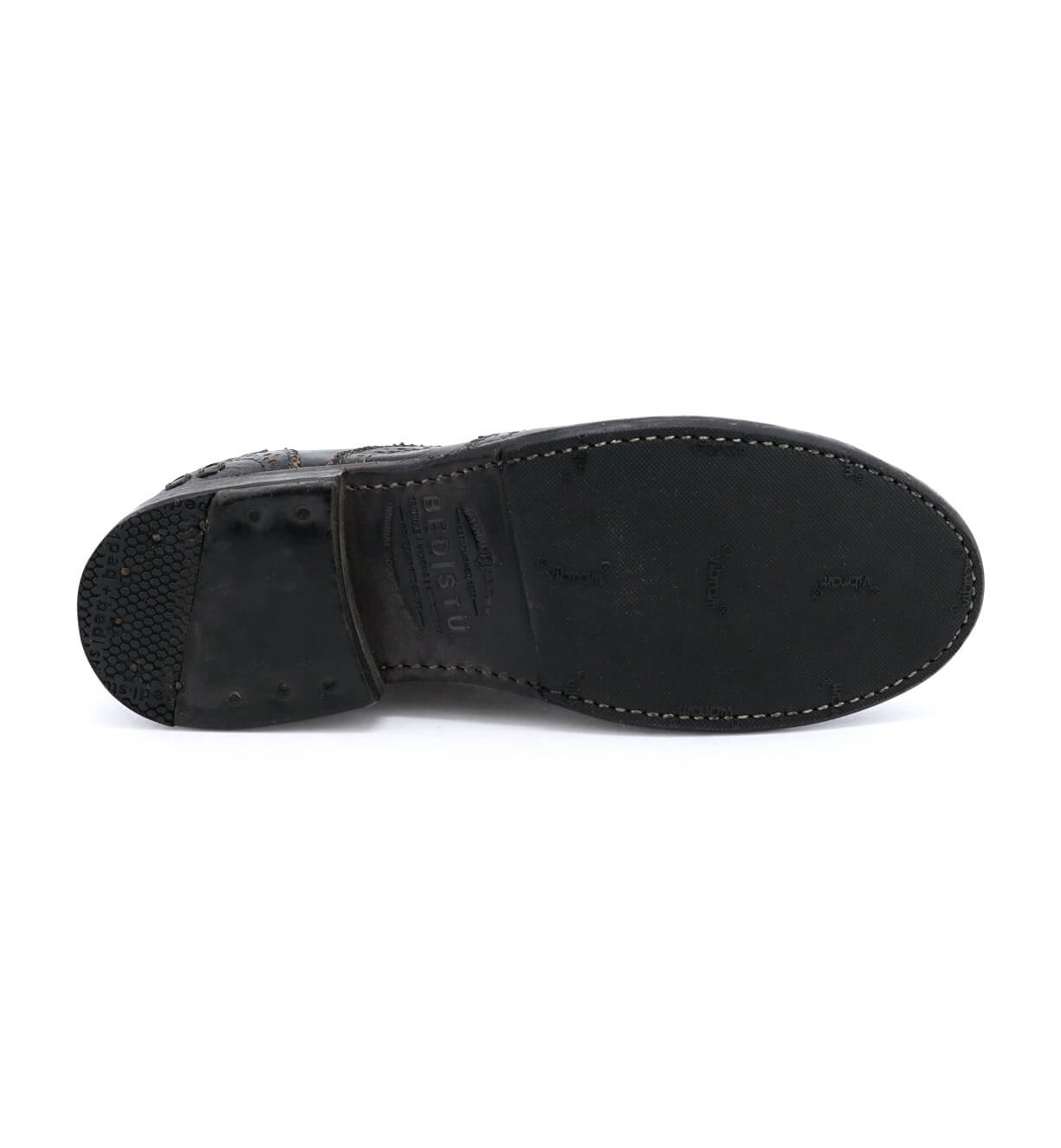 Outsole of the distressed black wingtip oxford shoe called "Lita" by Bed Stu.