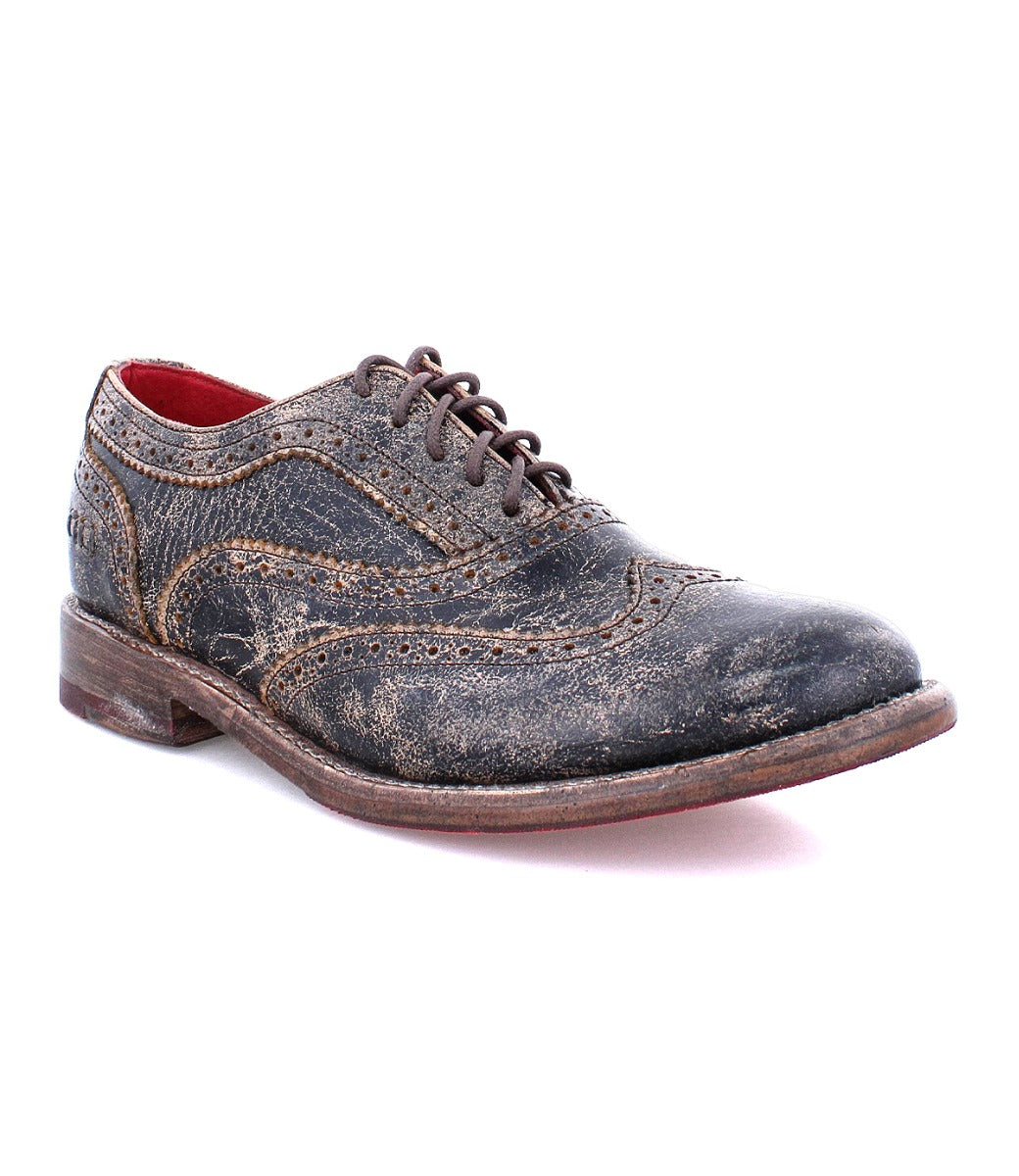 A women's distressed black wingtip oxford shoe called "Lita" by Bed Stu.