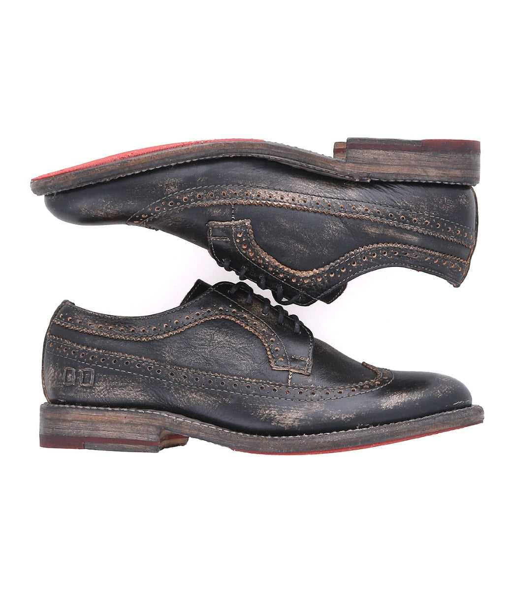 A pair of Bed Stu Lita K II wingtip oxford shoes with red soles.