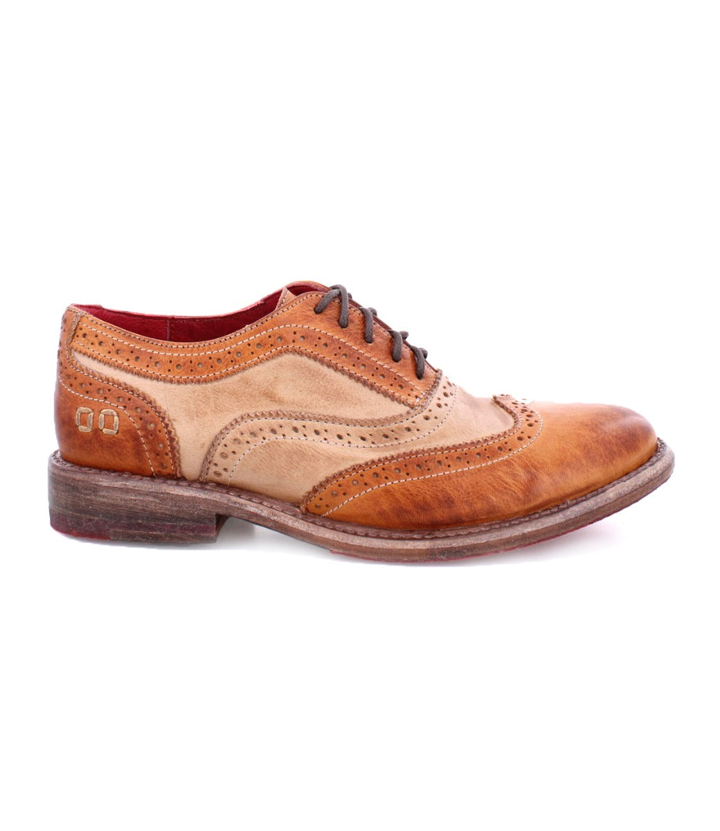 A tan and brown wingtip oxford shoe called "Lita" by Bed Stu.