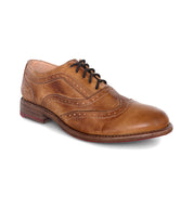 A tan wingtip oxford shoe, called the Lita by Bed Stu.