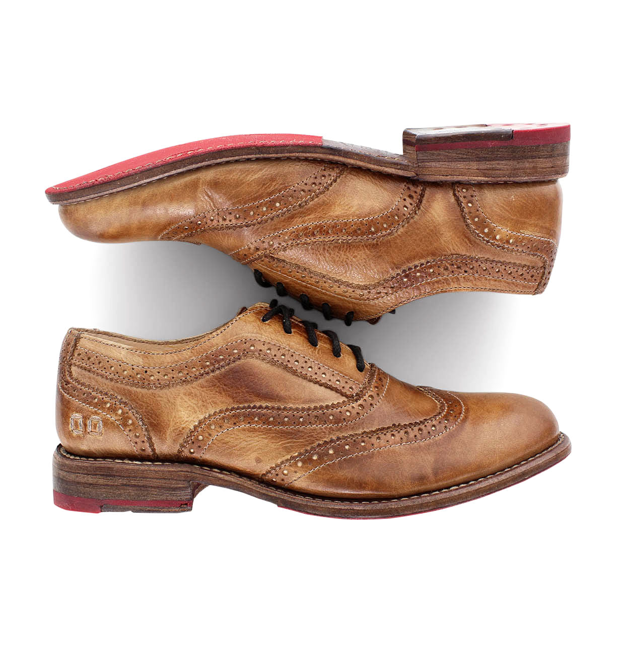 A pair of Bed Stu Lita tan shoes with red soles.