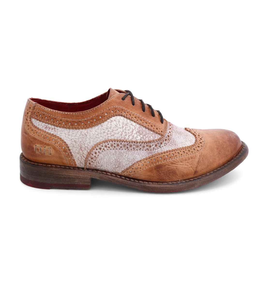 A distressed tan and white wingtip oxford shoe called Lita by Bed Stu.
