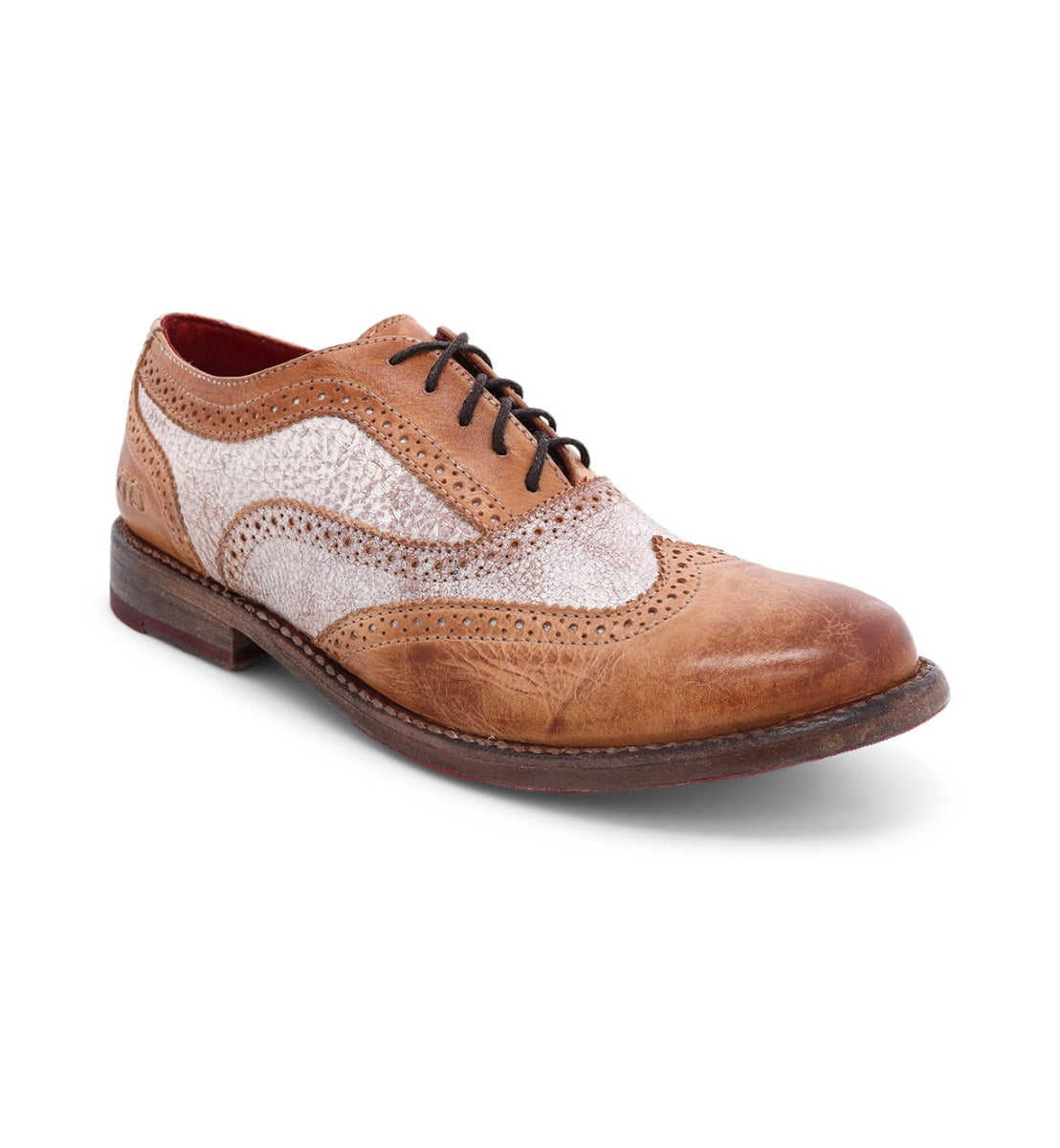A distressed tan and white wingtip oxford shoe called Lita by Bed Stu.