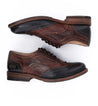 A pair of brown and black Bed Stu Lita oxford shoes.