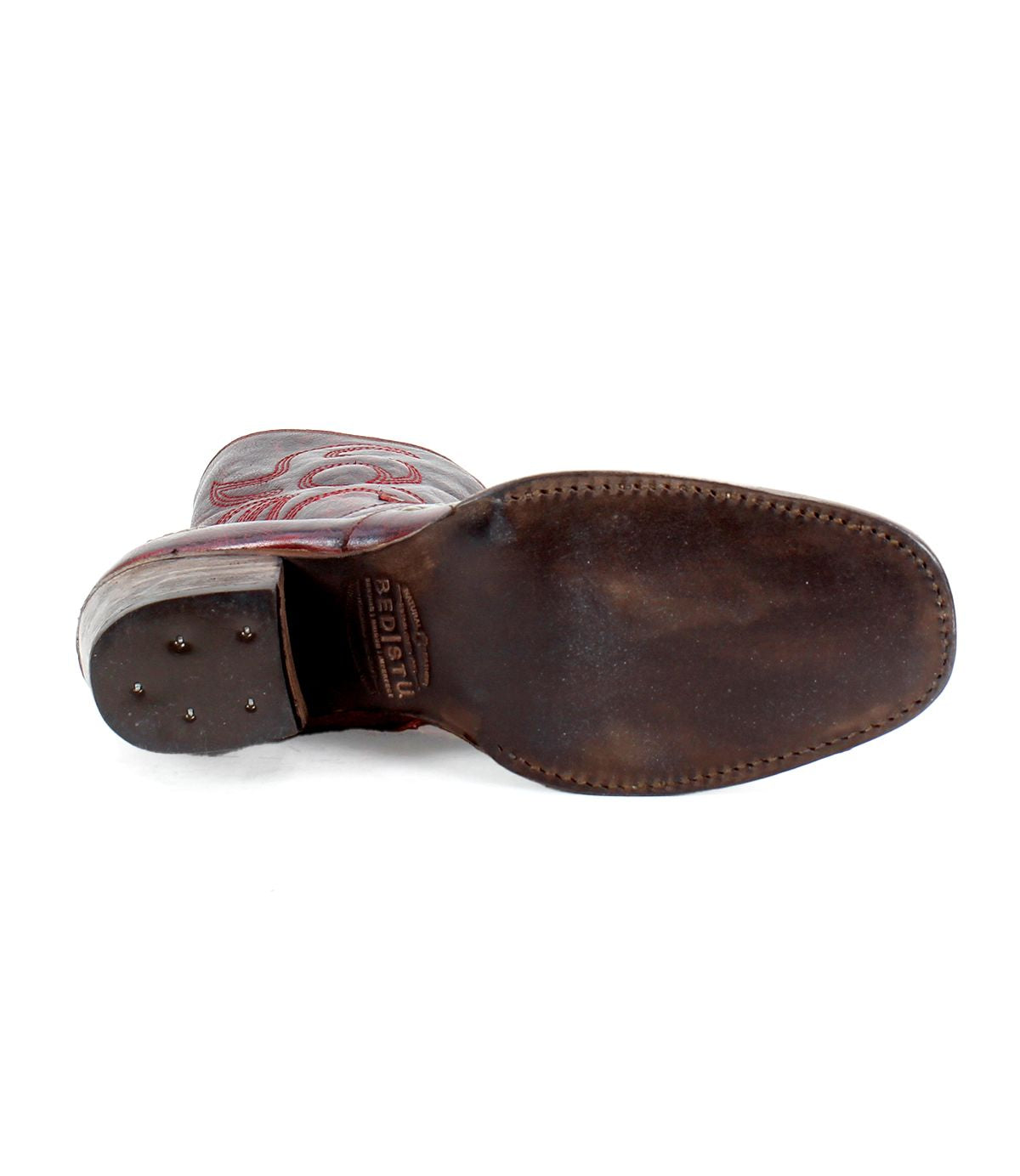 View of a Bed Stu Locate boot's sole, showing visible wear and flame-like stitching on the upper part.