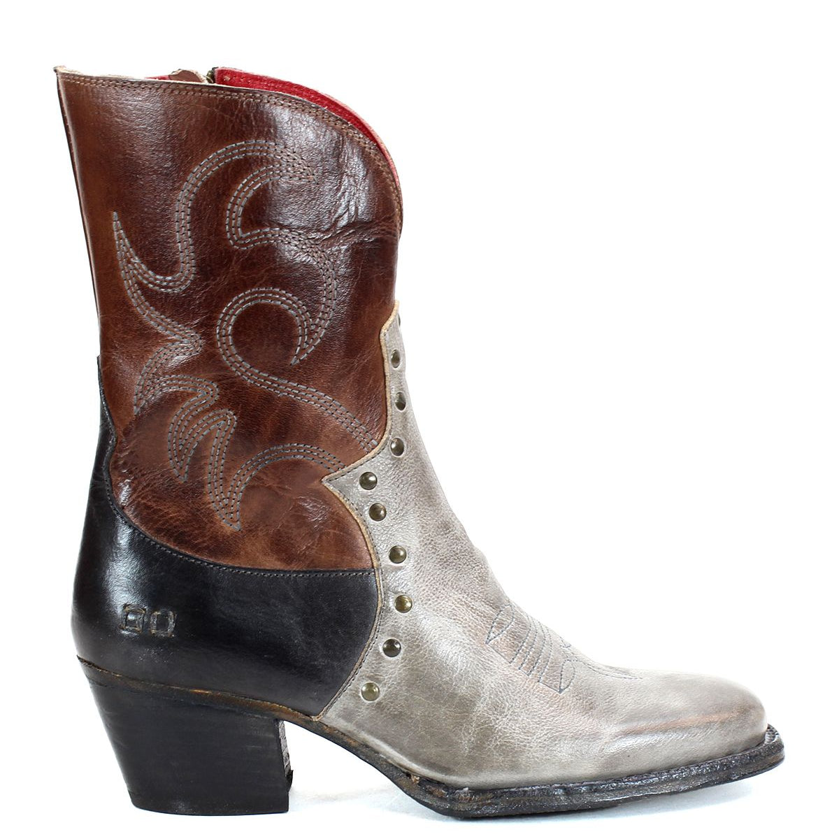 The "Locate" boot by Bed Stu features a brown upper with flame-like stitching, a gray lower section accented by rivets, and a black heel and toe.