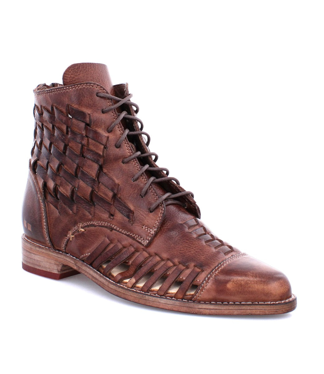 A brown leather boot with woven detailing, the Loretta by Bed Stu.