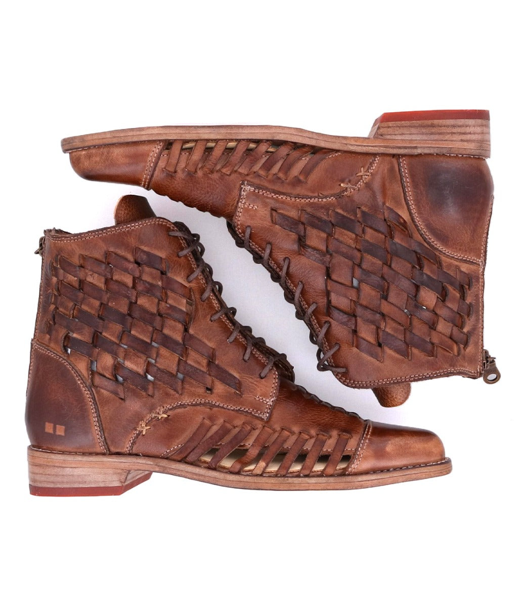 A pair of brown leather Loretta boots with woven details by Bed Stu.