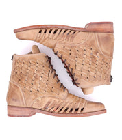 A pair of Loretta boots by Bed Stu with woven details.