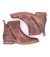 A pair of Lotus brown leather ankle boots with zippers by Bed Stu.