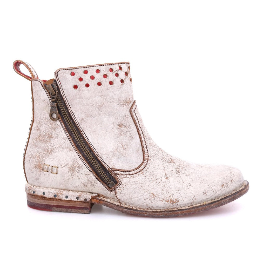 A women's Lotus ankle boot with red studs from Bed Stu.