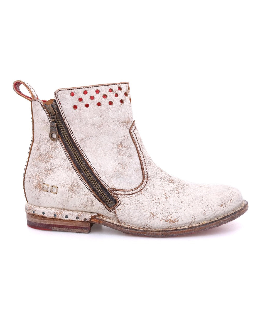 A women's Lotus ankle boot with red studs from Bed Stu.