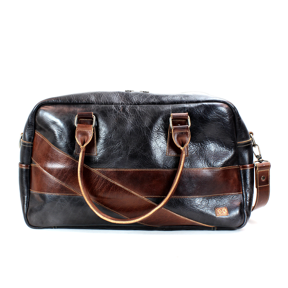 A Bed Stu "Luke" black and brown leather duffel bag with dual handles and an adjustable crossbody strap, perfect as a stylish travel companion.