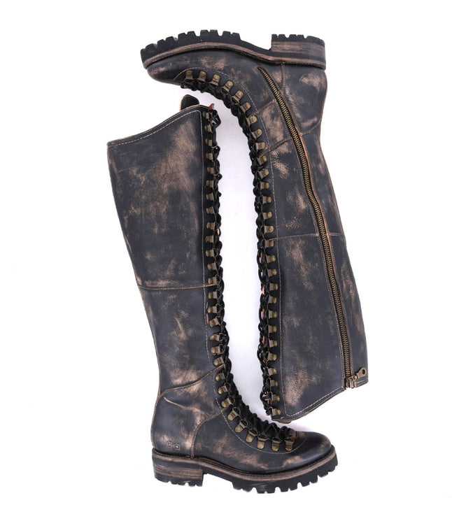 A pair of Bed Stu Lustrous black leather boots on a white background.