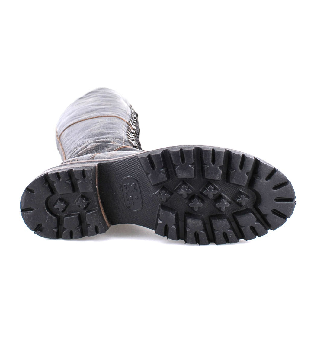 A pair of Lustrous grey boots with black soles on a white background by Bed Stu.