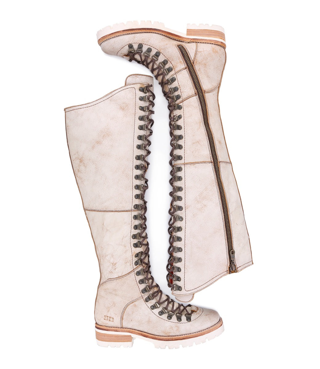 A pair of Lustrous women's boots with laces and zippers from the Bed Stu brand.