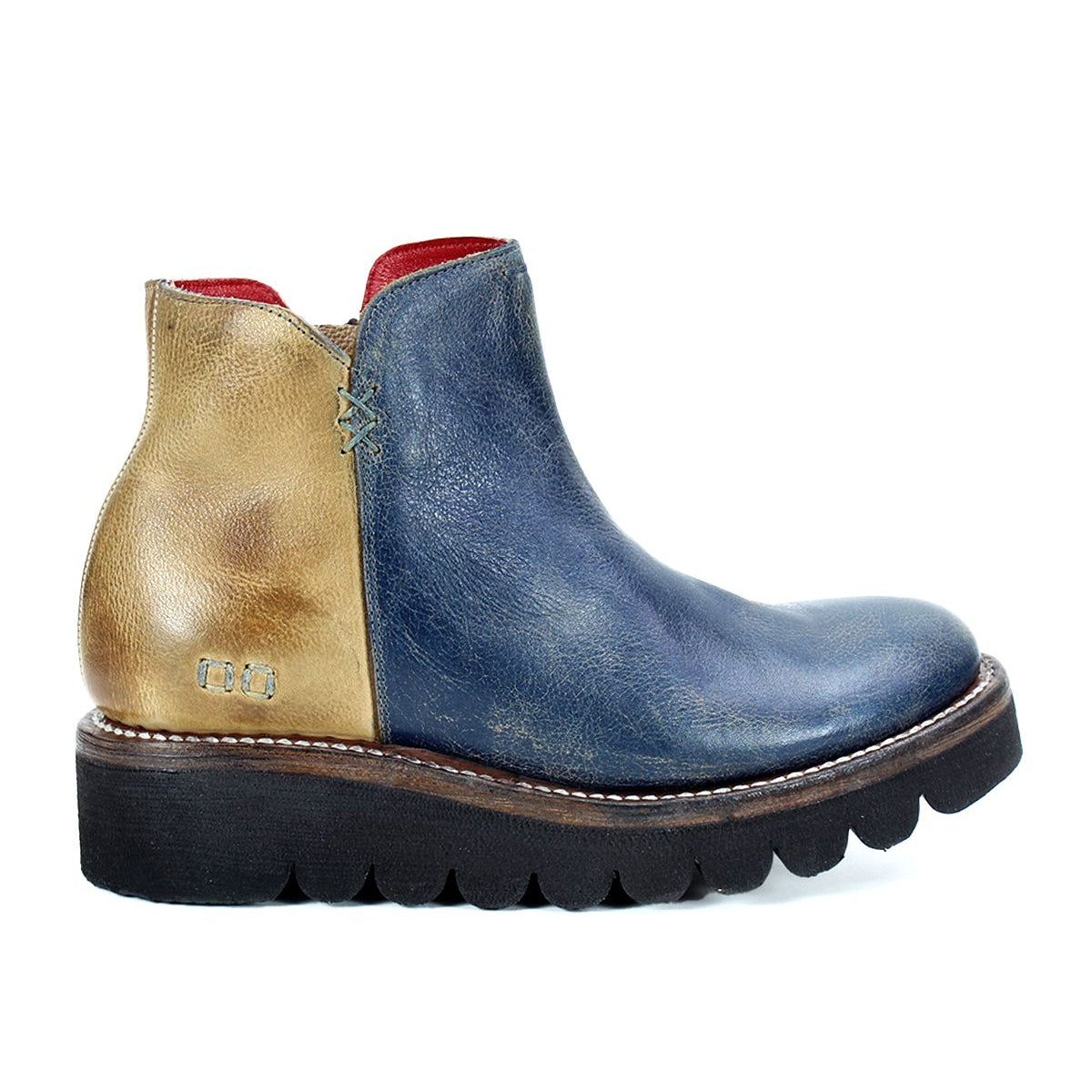The Lydyi by Bed Stu is a two-tone leather ankle boot with a blue front and brown heel, featuring a side zipper, thick black sole, lightweight platform outsole, cushioned breathable insole, and red interior lining.