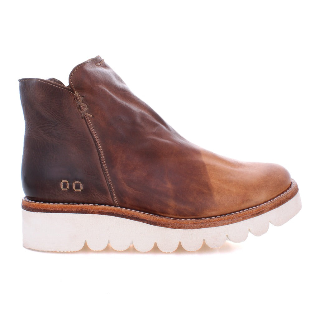 A women's brown ankle boot with a white sole, called the Lydyi by Bed Stu.