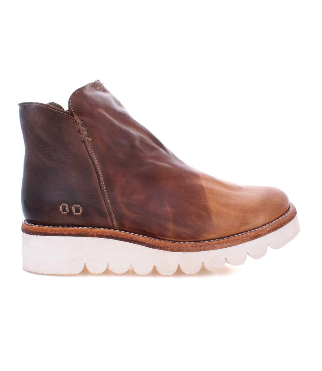A women's brown ankle boot with a white sole, called the Lydyi by Bed Stu.