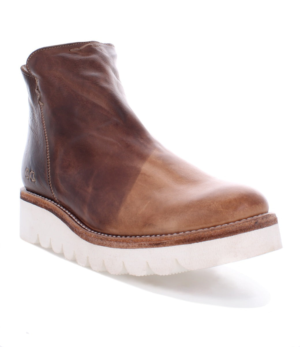 A women's brown ankle boot with a white sole, called the Lydyi by Bed Stu.