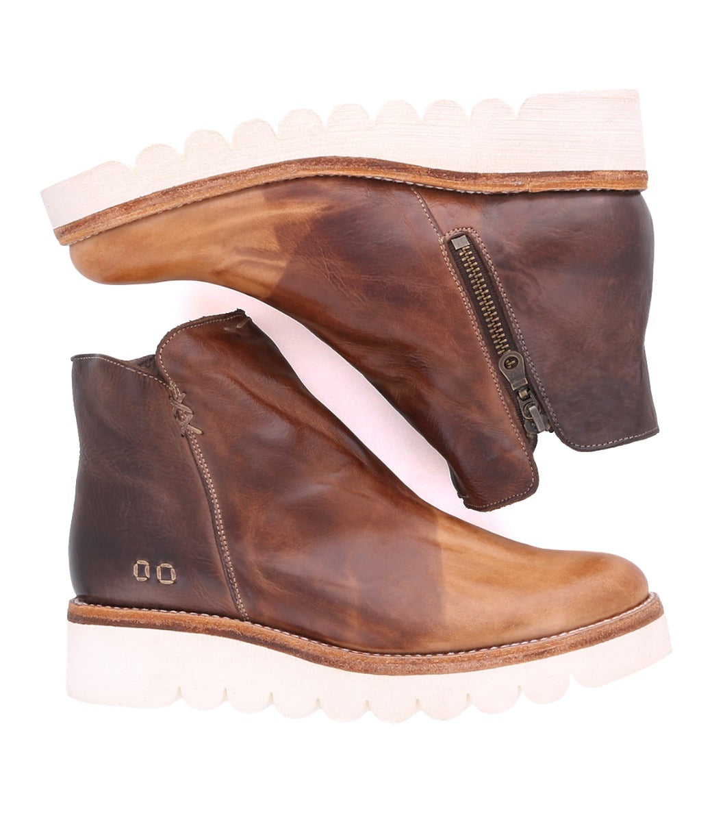 A pair of Lydyi brown leather ankle boots with white soles by Bed Stu.