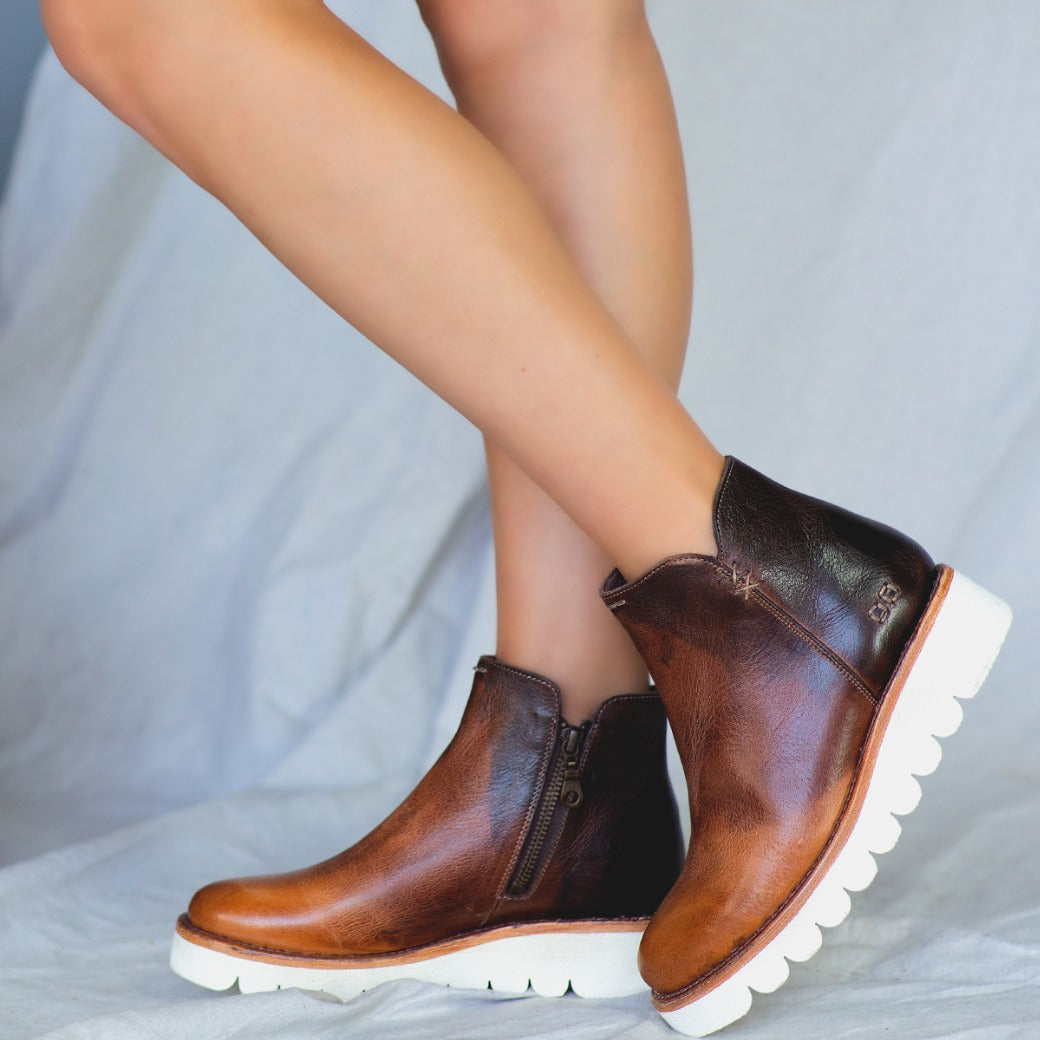 A woman in a pair of Bed Stu Lydyi brown leather boots.