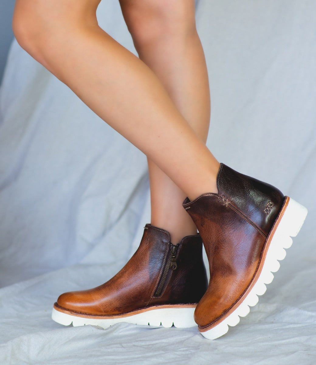 A woman in a pair of Bed Stu Lydyi brown leather boots.