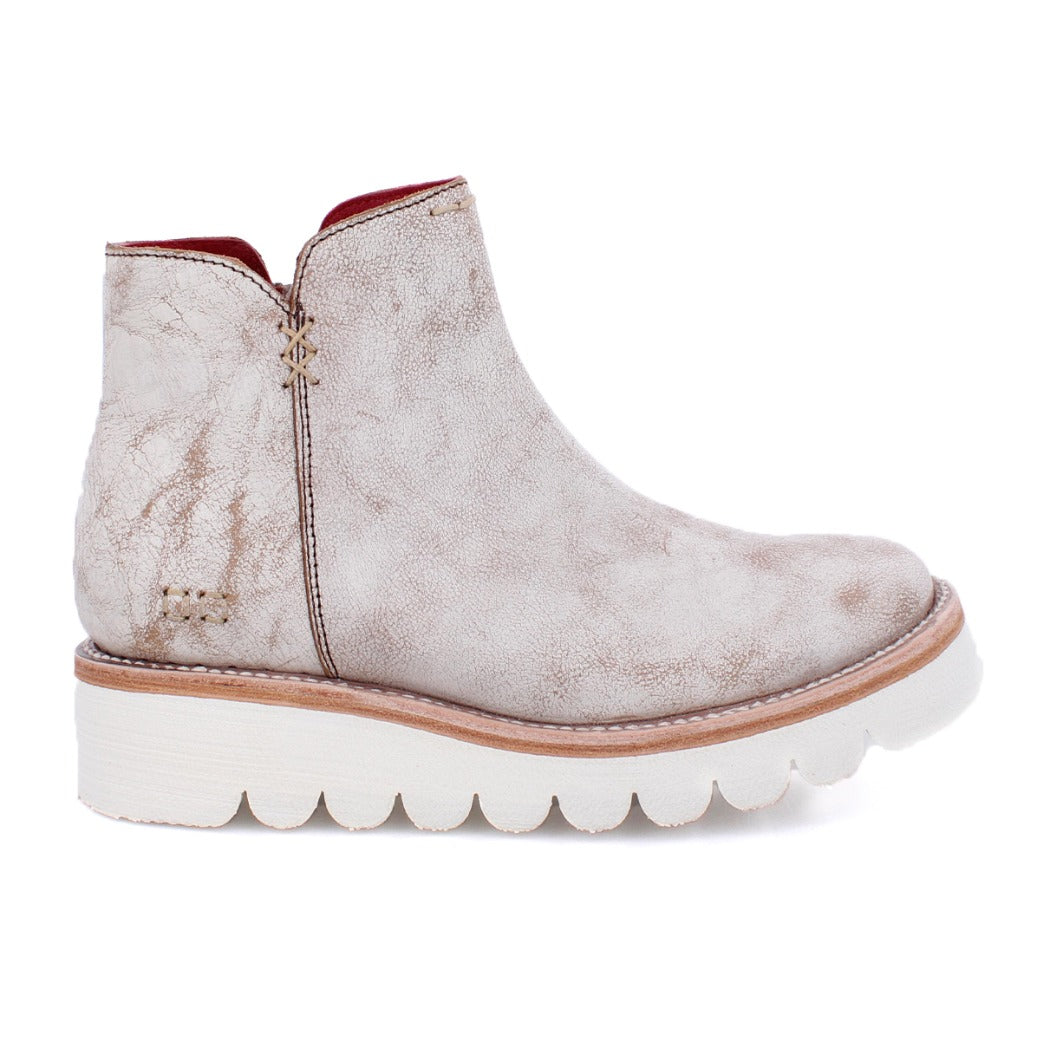 A women's white ankle boot with a white sole, called the Lydyi by Bed Stu.