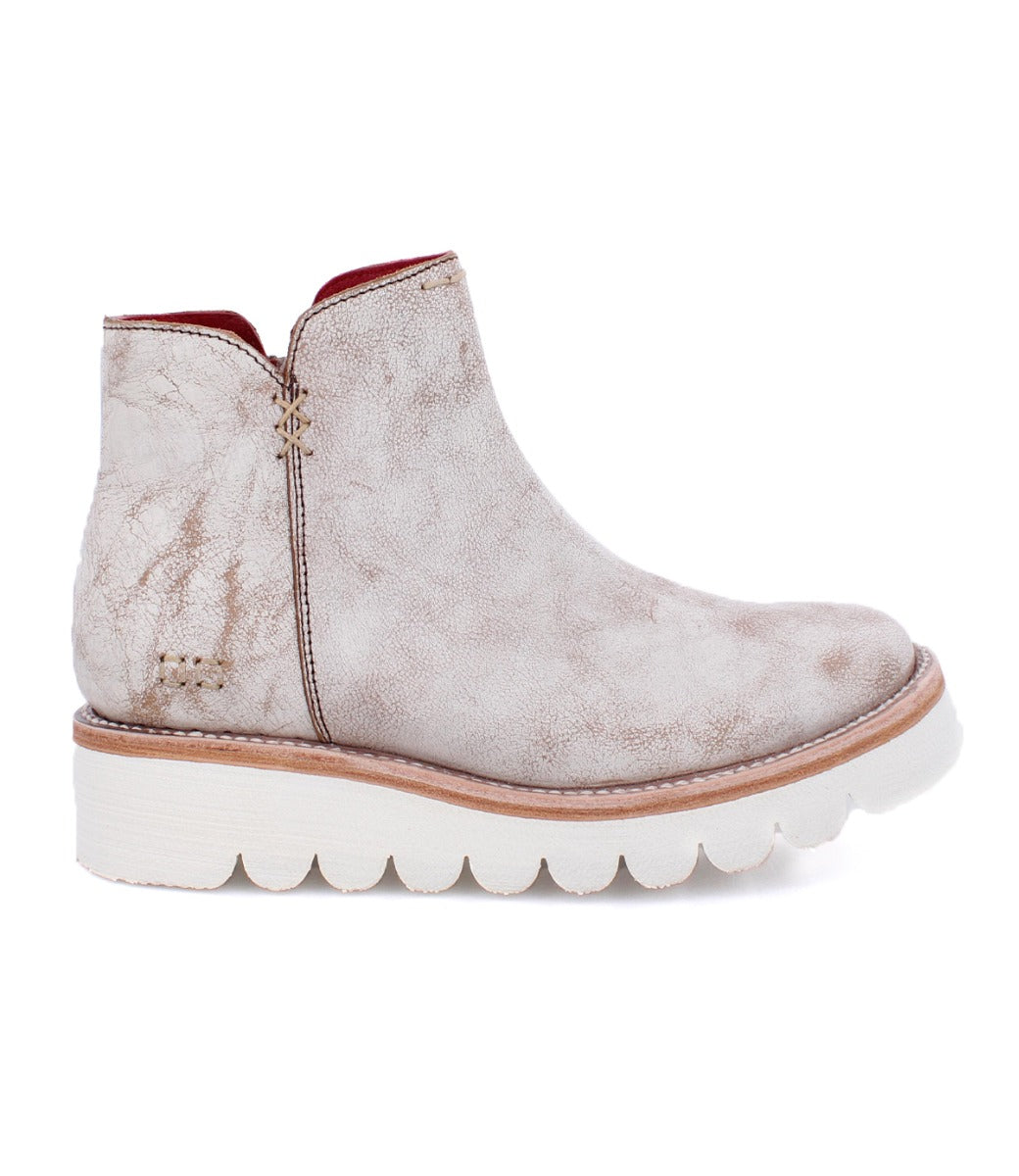 A women's white ankle boot with a white sole, called the Lydyi by Bed Stu.