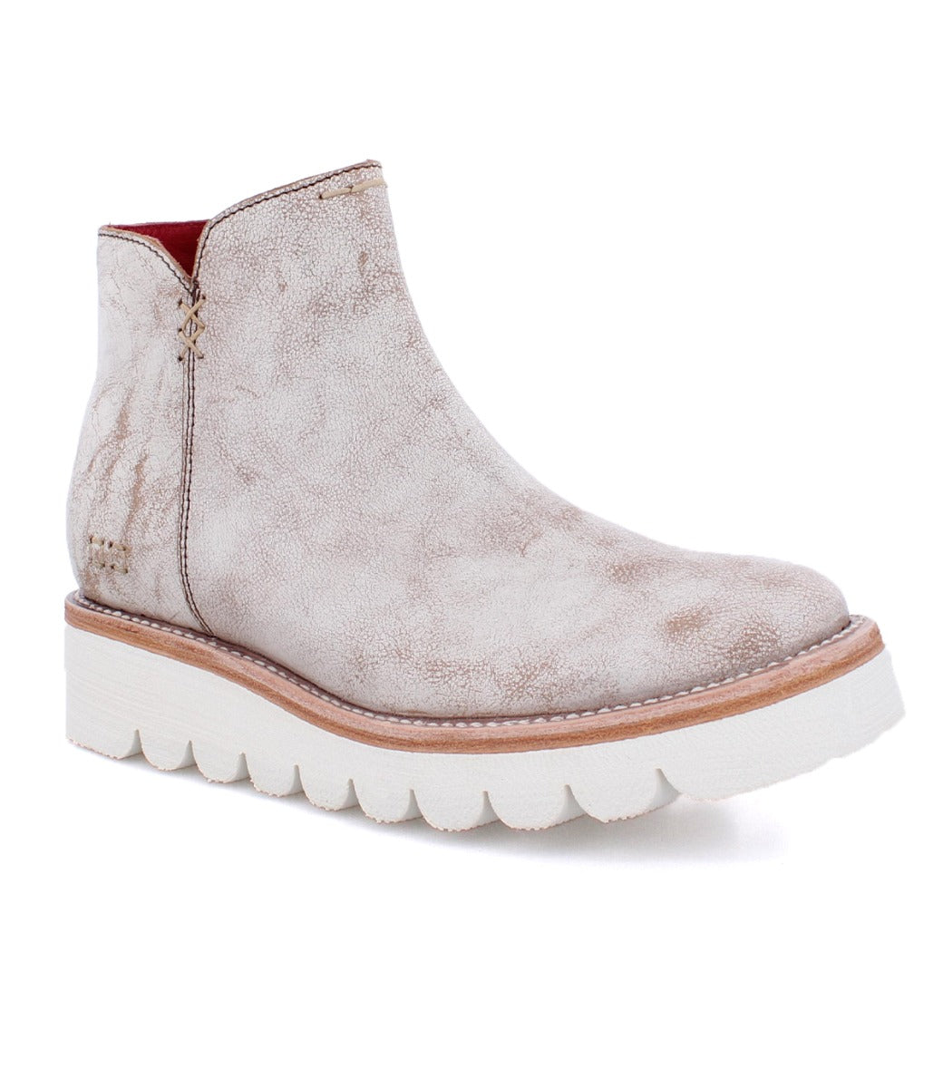A women's white ankle boot with a white sole, the Lydyi by Bed Stu.