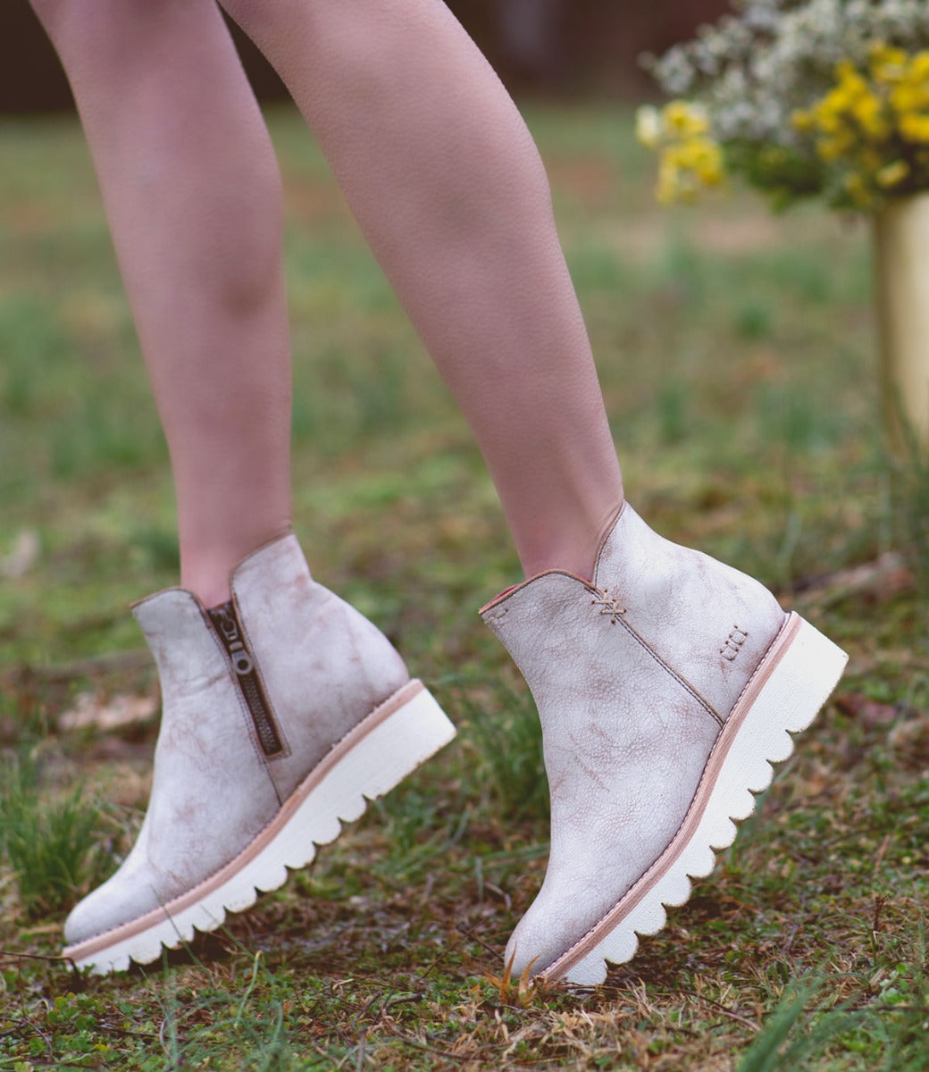 A woman in a pair of Bed Stu Lydyi ankle boots.