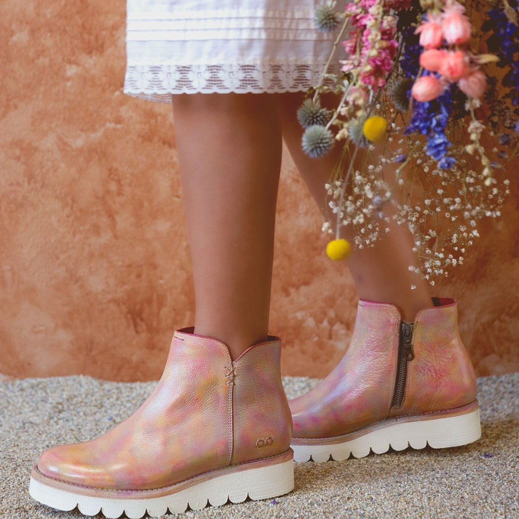 A woman wearing Bed Stu pink Lydyi boots.