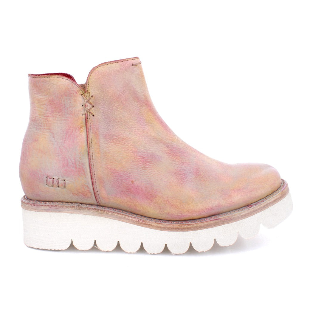 A women's pink ankle boot with a white sole, called the "Lydyi" by Bed Stu.