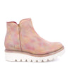 A women's pink ankle boot with a white sole, called the "Lydyi" by Bed Stu.